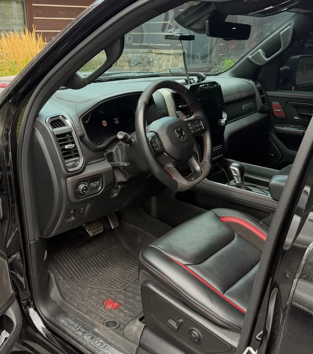 Ram TRX interior with black and red leather seats after a full detail
